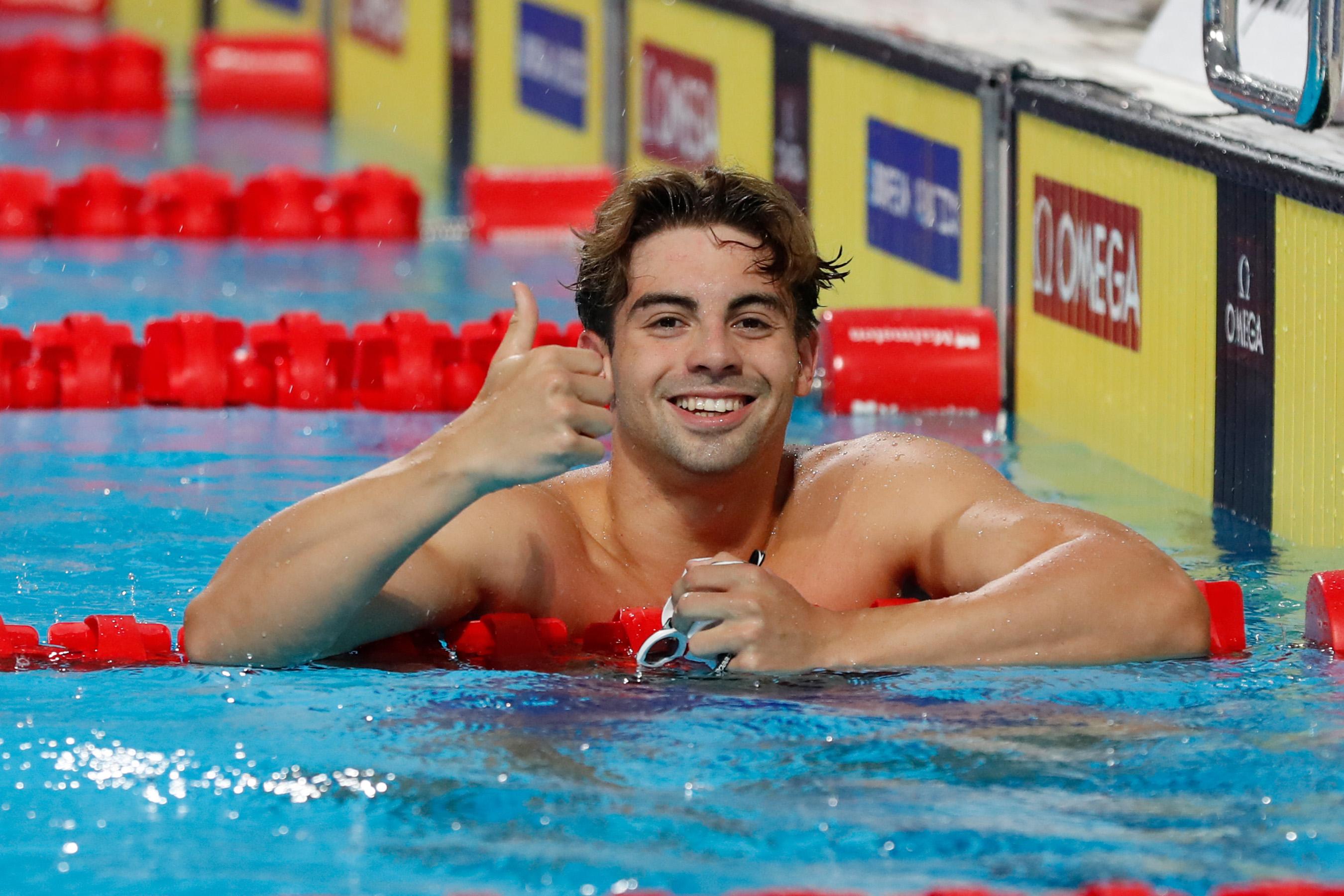 Kristian Pitshugin smiling in the pool after a race.