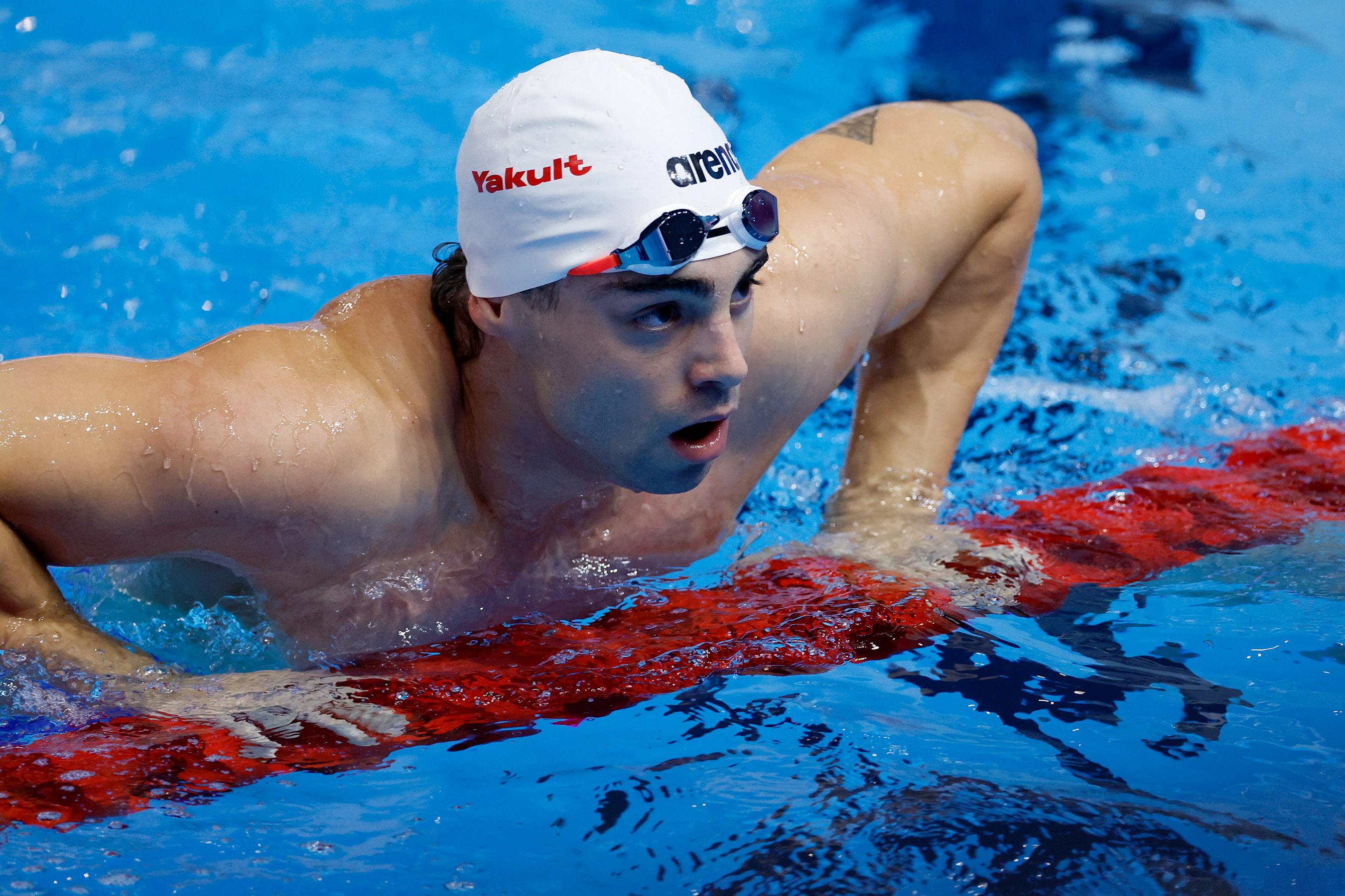 Kristian Pitshugin racing breaststroke in competition.